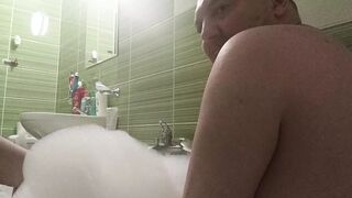 Lovers take a bath and he touch her busty body